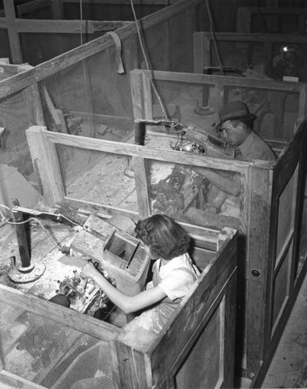 image of workers in button factory